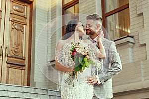 Caucasian romantic young couple celebrating their marriage in city