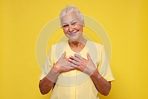 Caucasian senior laughing woman feeling pleased receiving a compliment