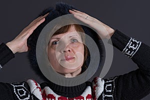 Caucasian senior woman in winter garments being happy