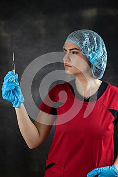 caucasian serious woman nurse or doctor hold syringe preparing patients vaccination antibiotic