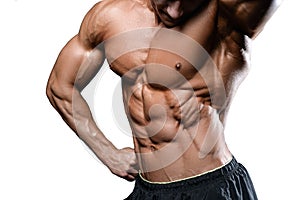 Caucasian fitness model in gym close up abs