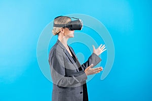 Caucasian smart business woman explaining while wearing VR goggles. Contraption.