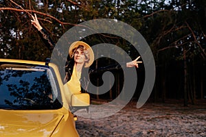 Caucasian Smiling Woman Leaning out of Car Window