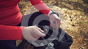 Caucasian sport cyclist woman sport off road bike park near tree. woman athlete in sport clothes and helmet and black