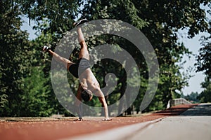 Caucasian Sports Man in Sunny Park Practice Elastic Training and Cardio for Better Body Shape