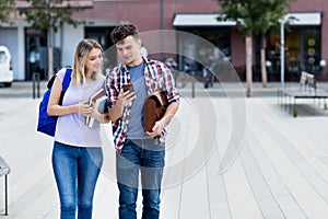 Caucasian student couple walking to the university