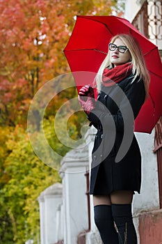 Caucasian student girl with red fully collapsible
