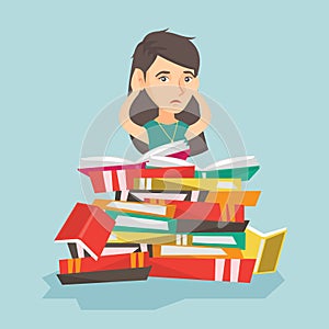 Caucasian student sitting in a huge pile of books.
