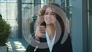 Caucasian successful woman girl happy satisfied business woman female businesswoman showing thumb up gesture raise up