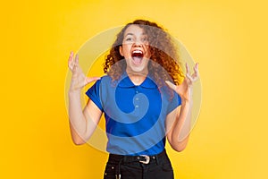 Caucasian teen`s girl portrait on yellow background