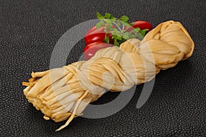 Caucasian traditional pigtail cheese served tomatoes