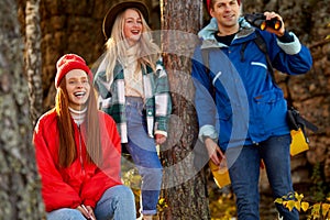 Caucasian travellers relax in forest. hiking and camping together