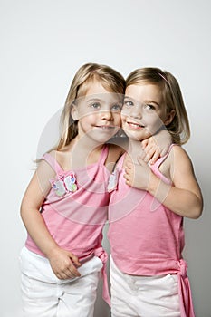Caucasian twin girls.