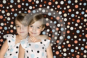 Caucasian twin girls looking at viewer. photo