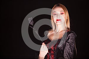 Caucasian vampire woman with bloody lips