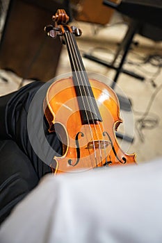 Caucasian violinist man wearing classical clothes and waiting for moment to start musical performance.