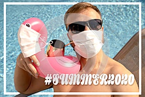 Caucasian white male near to a swimming pool with a toy flamingo in a medical face mask.