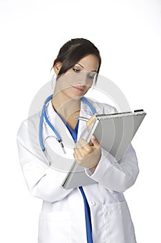Beautiful Caucasian woman doctor or nurse writing on the pad