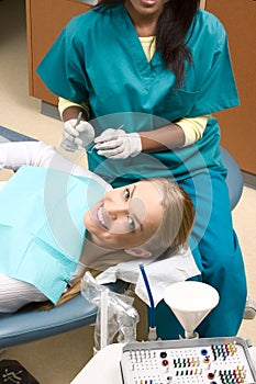 Caucasian woman and African-American dentist