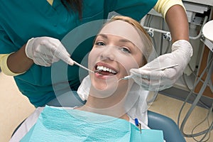 Caucasian woman and African-American dentist