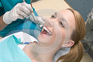 Caucasian woman and African-American dentist