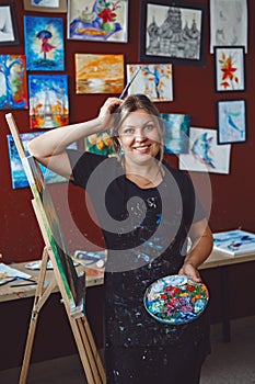 Caucasian woman artist drawing painting in art studio