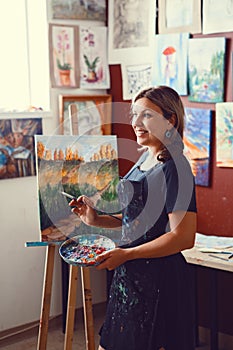 Caucasian woman artist drawing painting in art studio