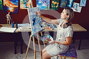 Caucasian woman artist drawing painting in art studio