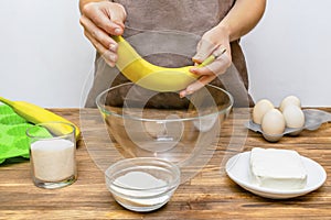 Caucasian woman chef in apron preparing ingredients for making cottage cheese muffins cupcakes casserole at home kitchen