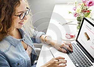 Caucasian woman creative shoot working on laptop