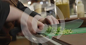 Caucasian woman cutting vegetables