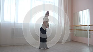 Caucasian woman dancing contemporary in ballet class. Rehearsal.