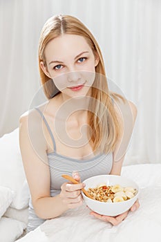 Caucasian woman eating a serial