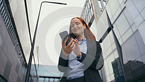 Caucasian woman employer entrepreneur smiling happy female carefree positive business manager businesswoman using phone
