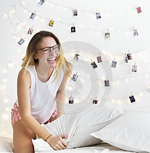 A Caucasian woman enjoy pillow fight