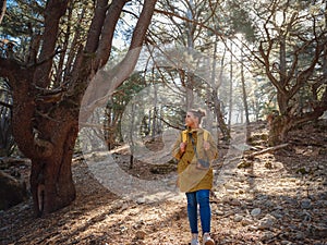 caucasian woman enjoys being in nature,