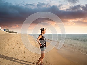 Caucasian woman enjoys the sun and the beach at Fuerteventura