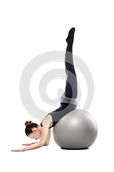 Caucasian woman exercising pilates