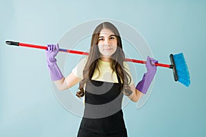 Caucasian woman happy to start doing cleaning chores at home