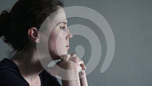 Caucasian woman in her thirties (30s) sitting at a table upset