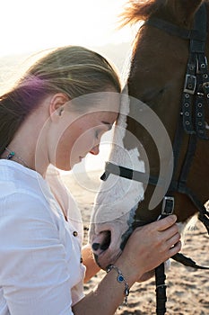 Caucasian woman hugging horse slow motion. Love and friendship concept.