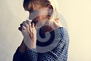 Caucasian woman with interlocked fingers photo