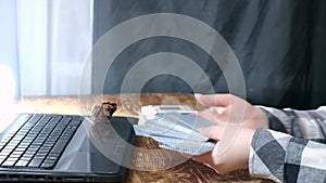 caucasian woman laying out cards on a wooden table
