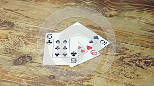 caucasian woman laying out cards on a wooden table