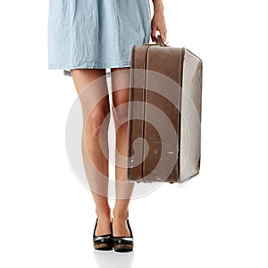 Caucasian woman legs with travel case