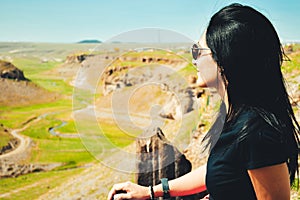 Caucasian woman lookout enjoy scenic nature panorama outdoors on viewpoint in summer on holiday vacation