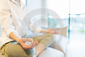 caucasian woman meditating at home