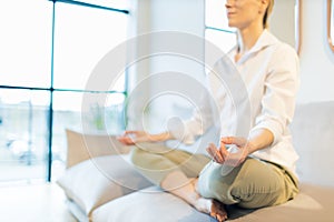 caucasian woman meditating at home