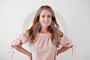 Caucasian woman model with ginger hair posing indoors