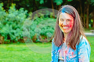 caucasian woman portrait in traditional indian holi festival paints